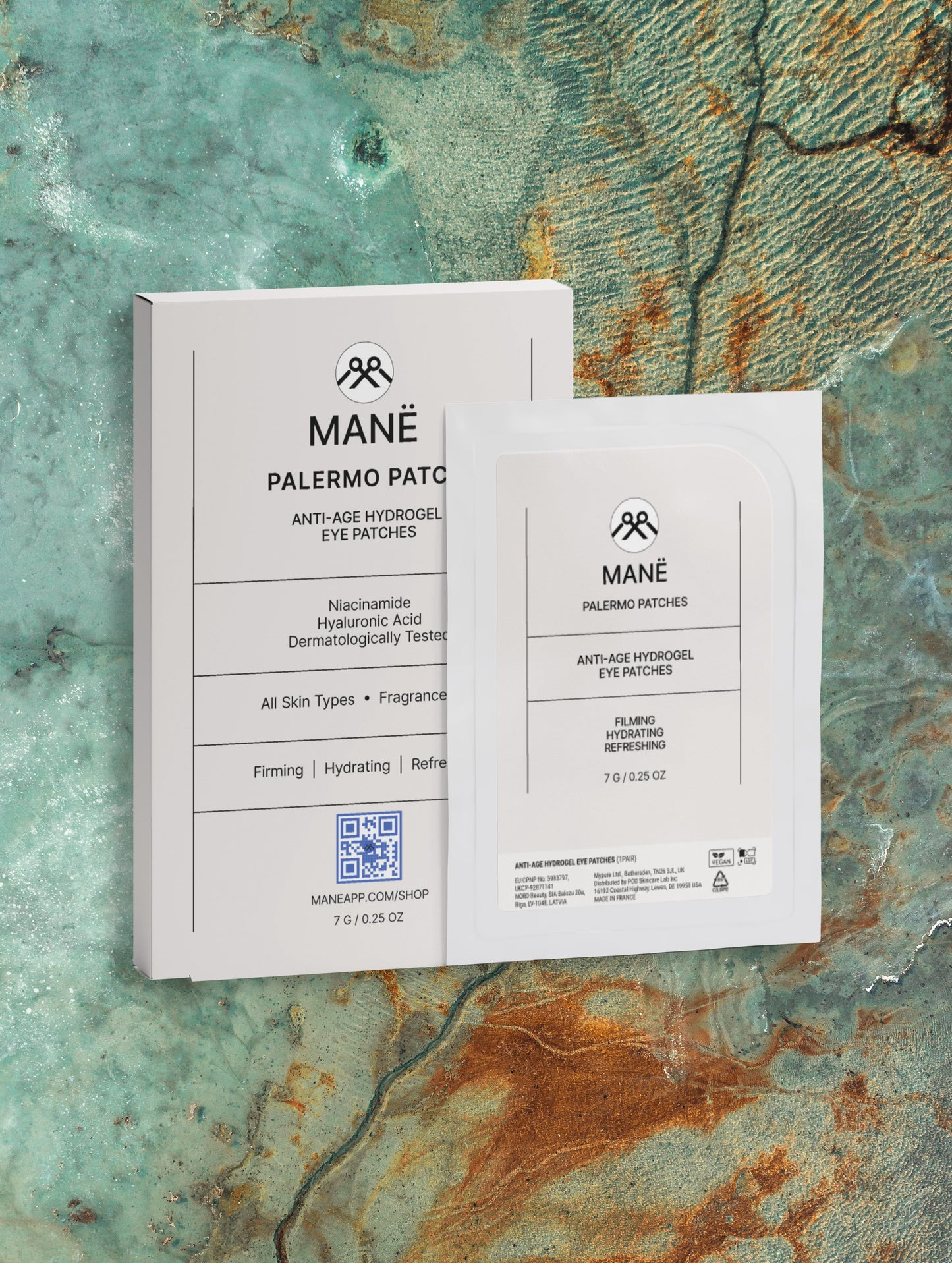 MANË Palermo Patches box and sachet against a patina background